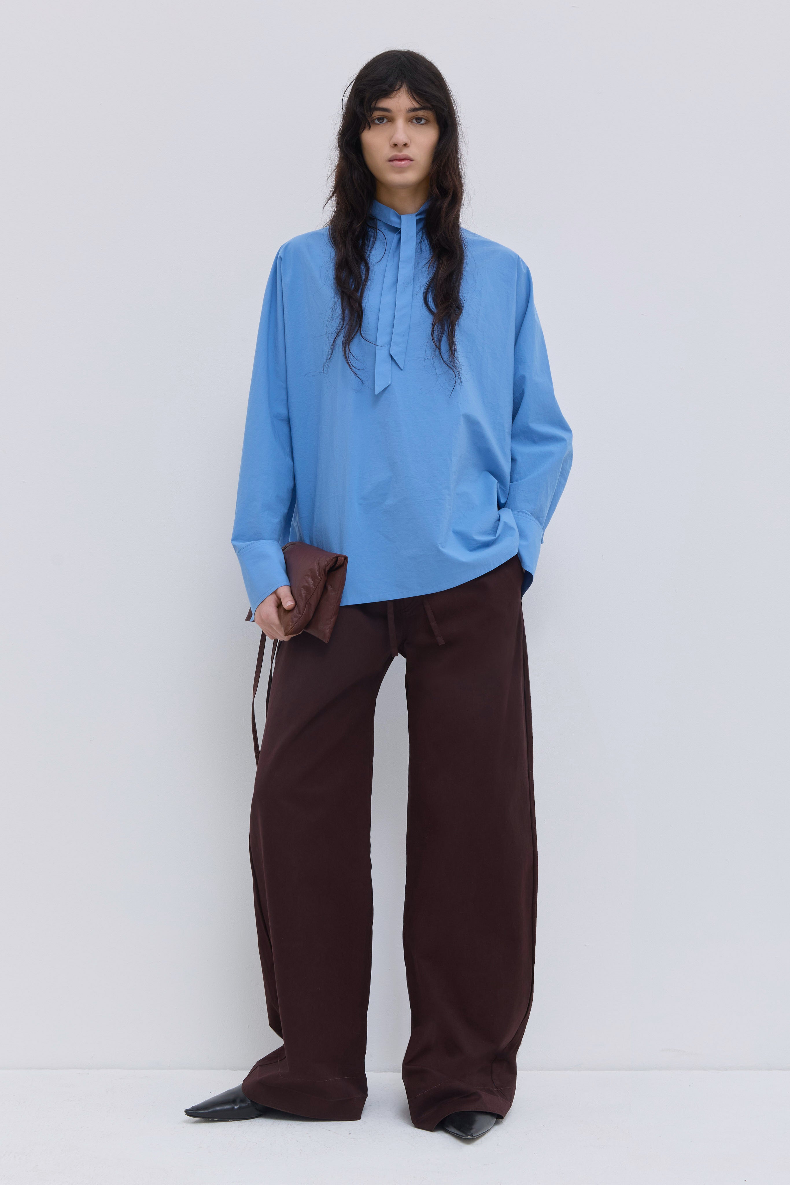Tuvra batwing sleeve top in cerulean organic cotton with relaxed fit and front tie detail.