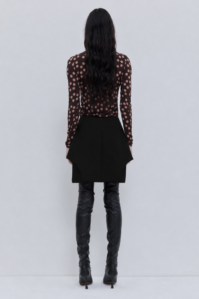 Black layered mini skirt with sculptural silhouette.