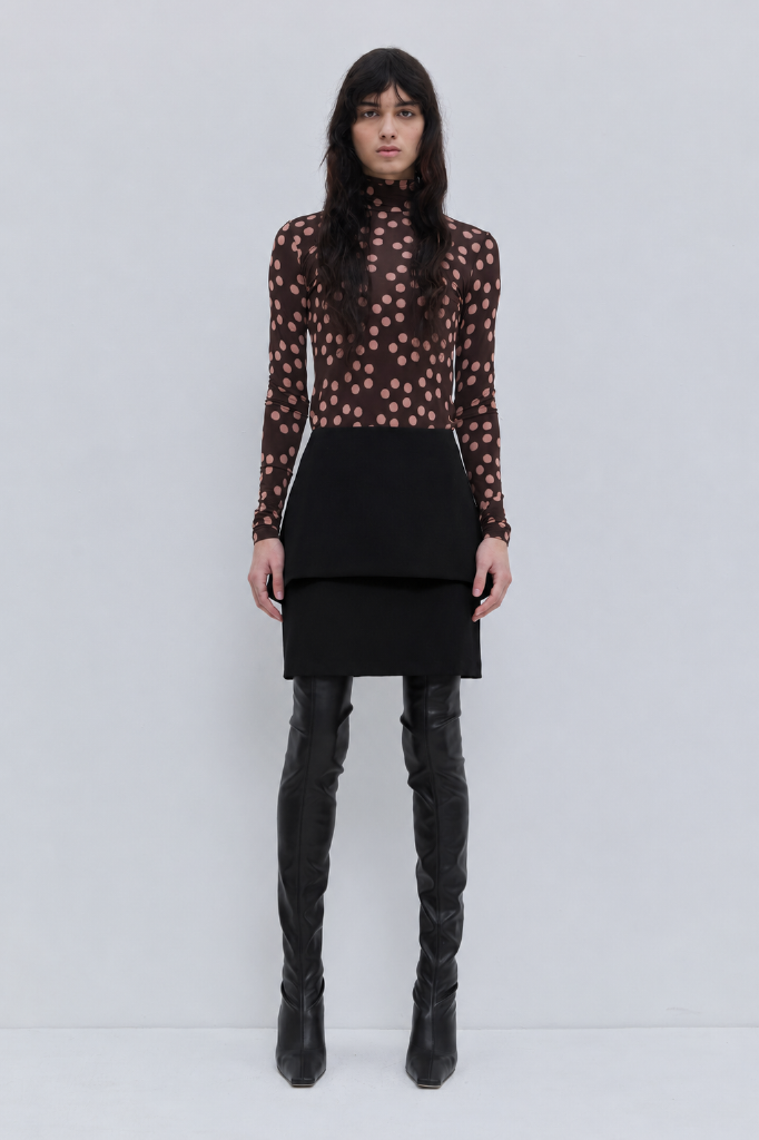 Black double-layer mini skirt in woven fabric.