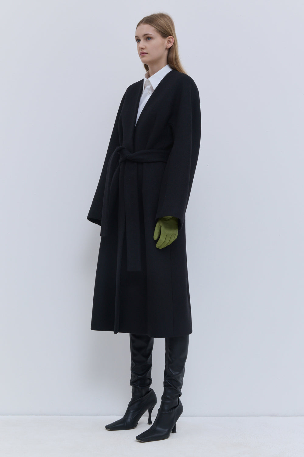 Christian Wijnants black wool coat with rounded sleeves and a defined waist