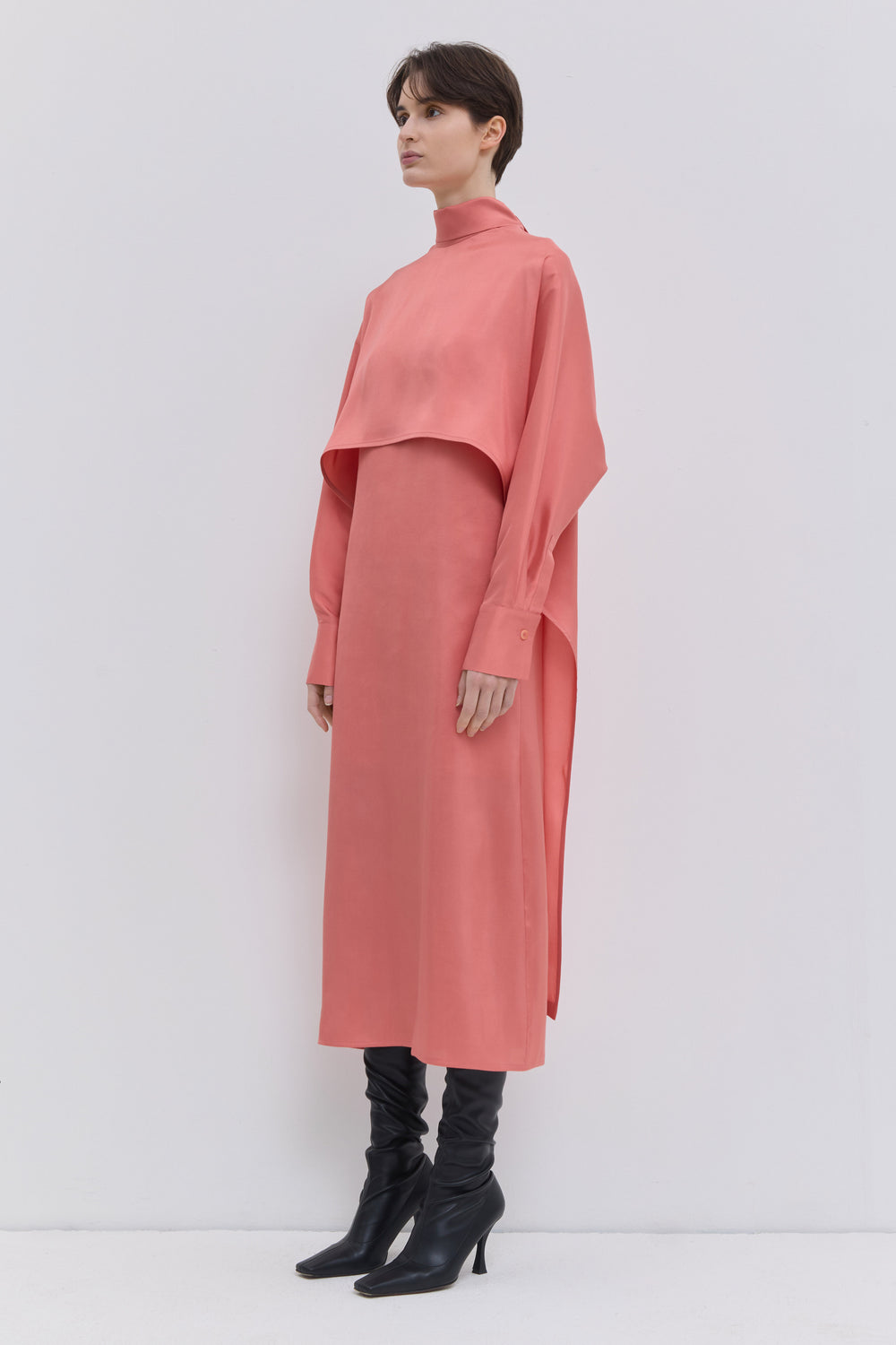 Luxury coral silk midi dress with fluid silhouette and versatile scarf neckline
