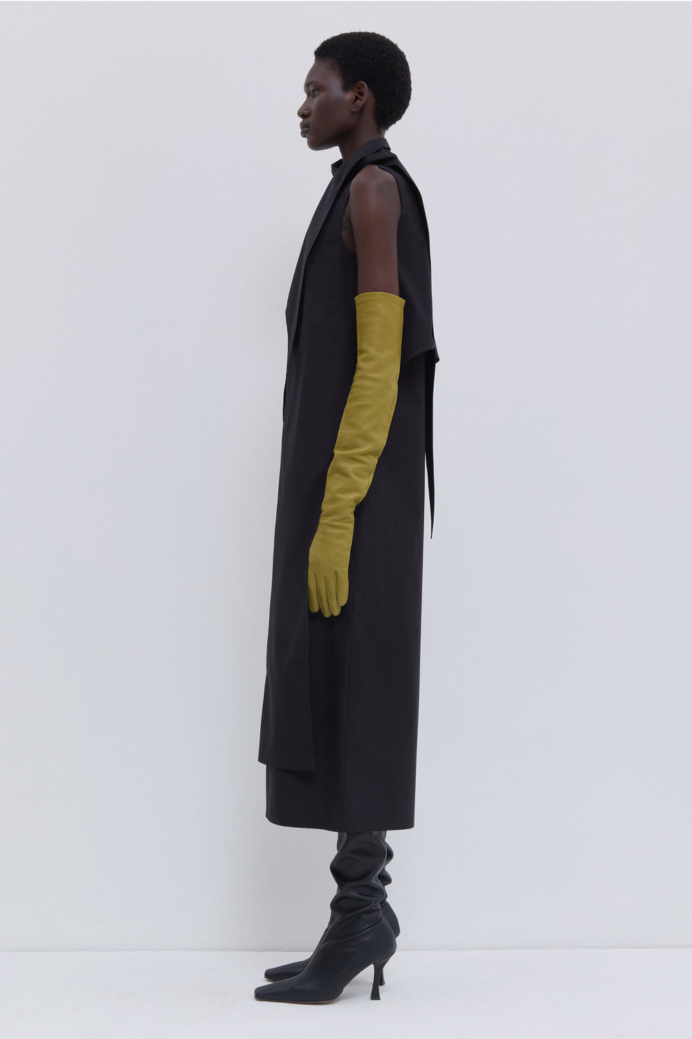 Black cotton midi dress with long scarf detail, sleeveless design and layered front panel by Christian Wijnants.
