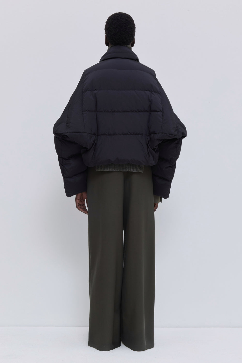 Back view of the Jani signature down jacket in black.
