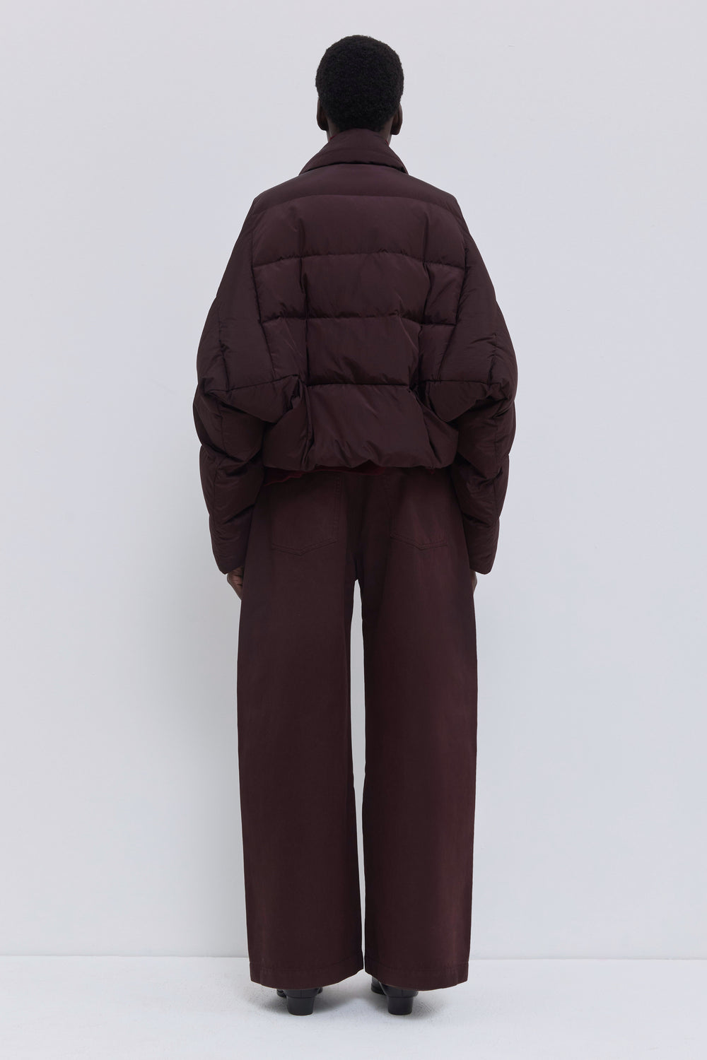 Back view of the Jani signature down jacket in plum.