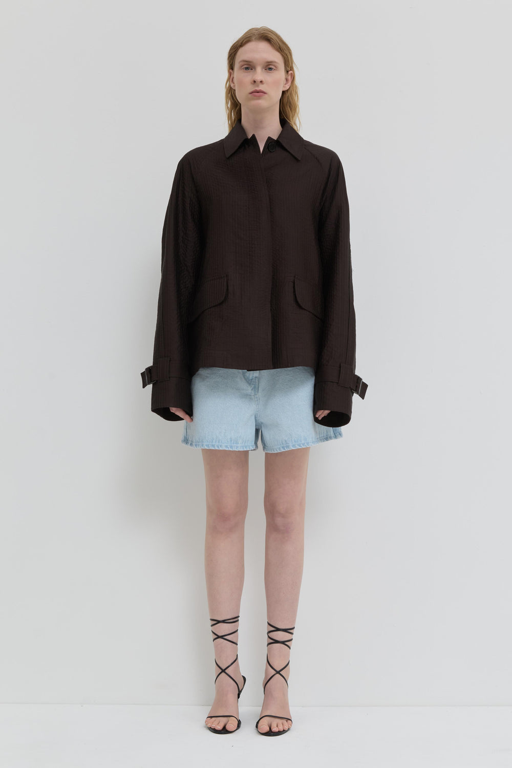 Chocolate quilted jacket with belted cuffs and relaxed fit