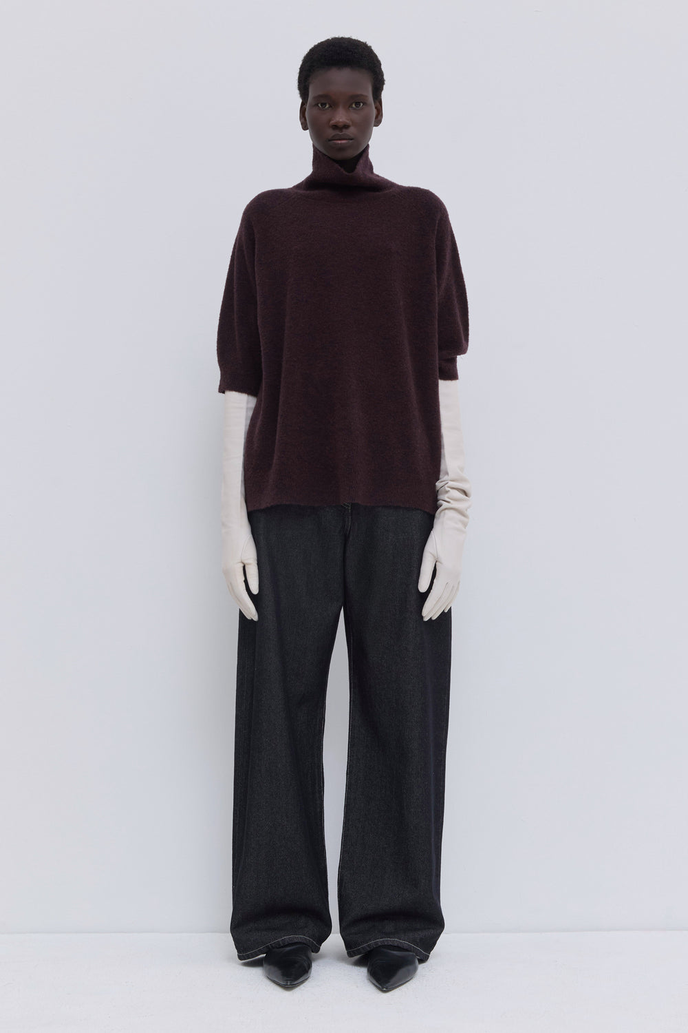 Deep plum bouclé turtleneck knit top with short sleeves and relaxed fit.