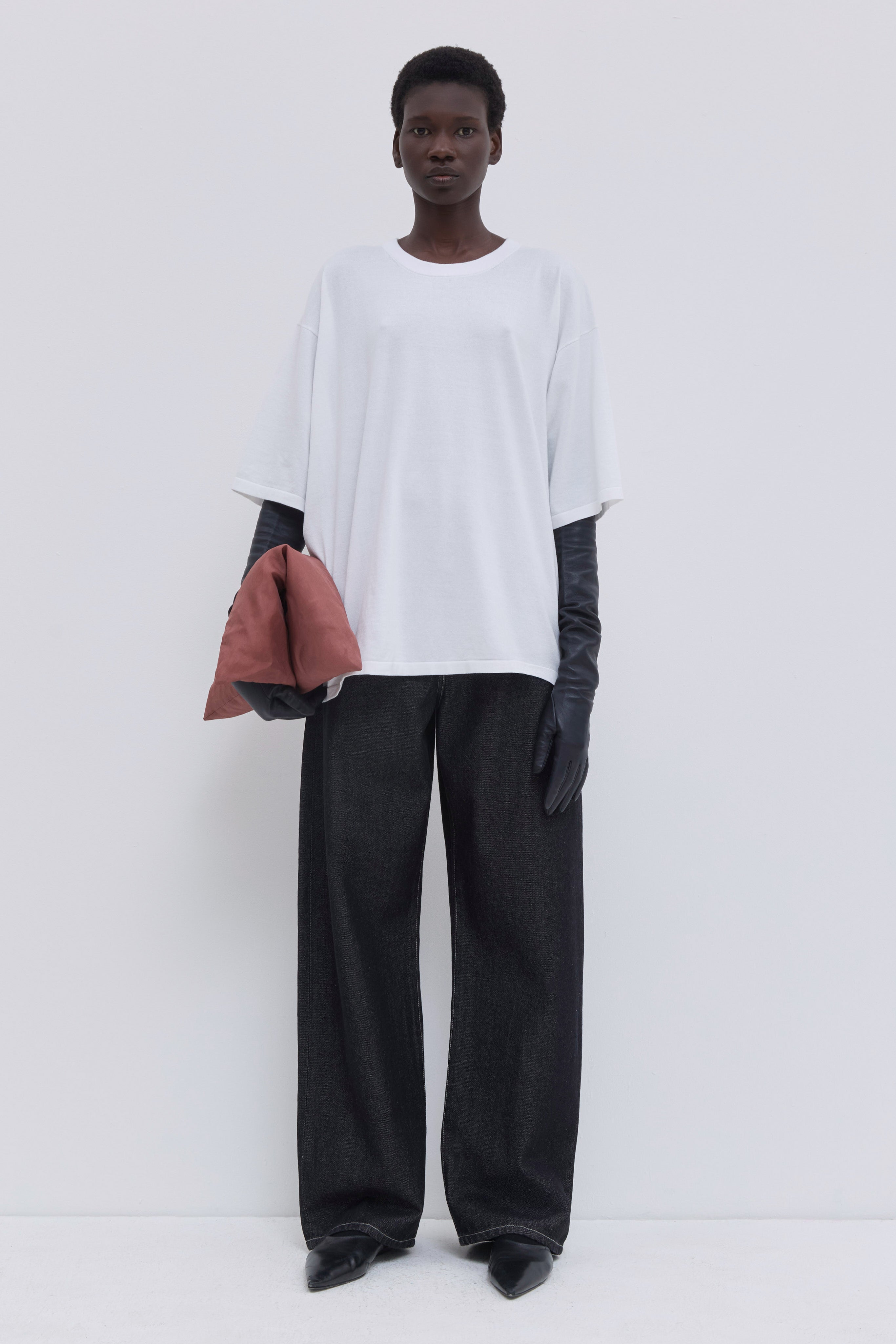 Luxury white cotton oversized T-shirt with wide short sleeves and minimalist design.