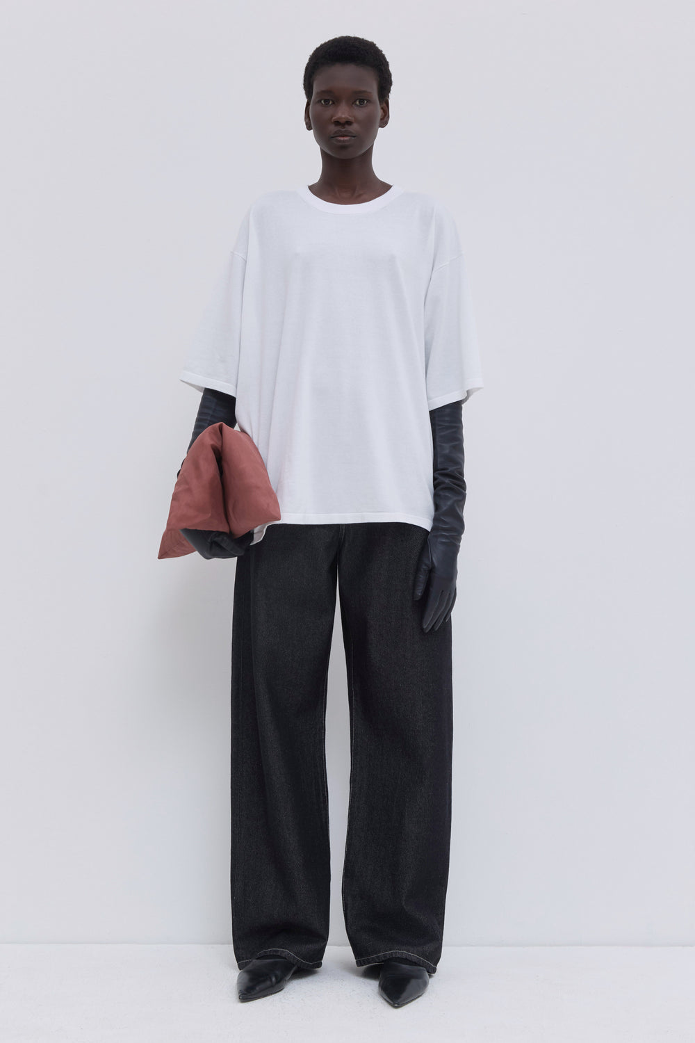 Luxury white cotton oversized T-shirt with wide short sleeves and minimalist design.