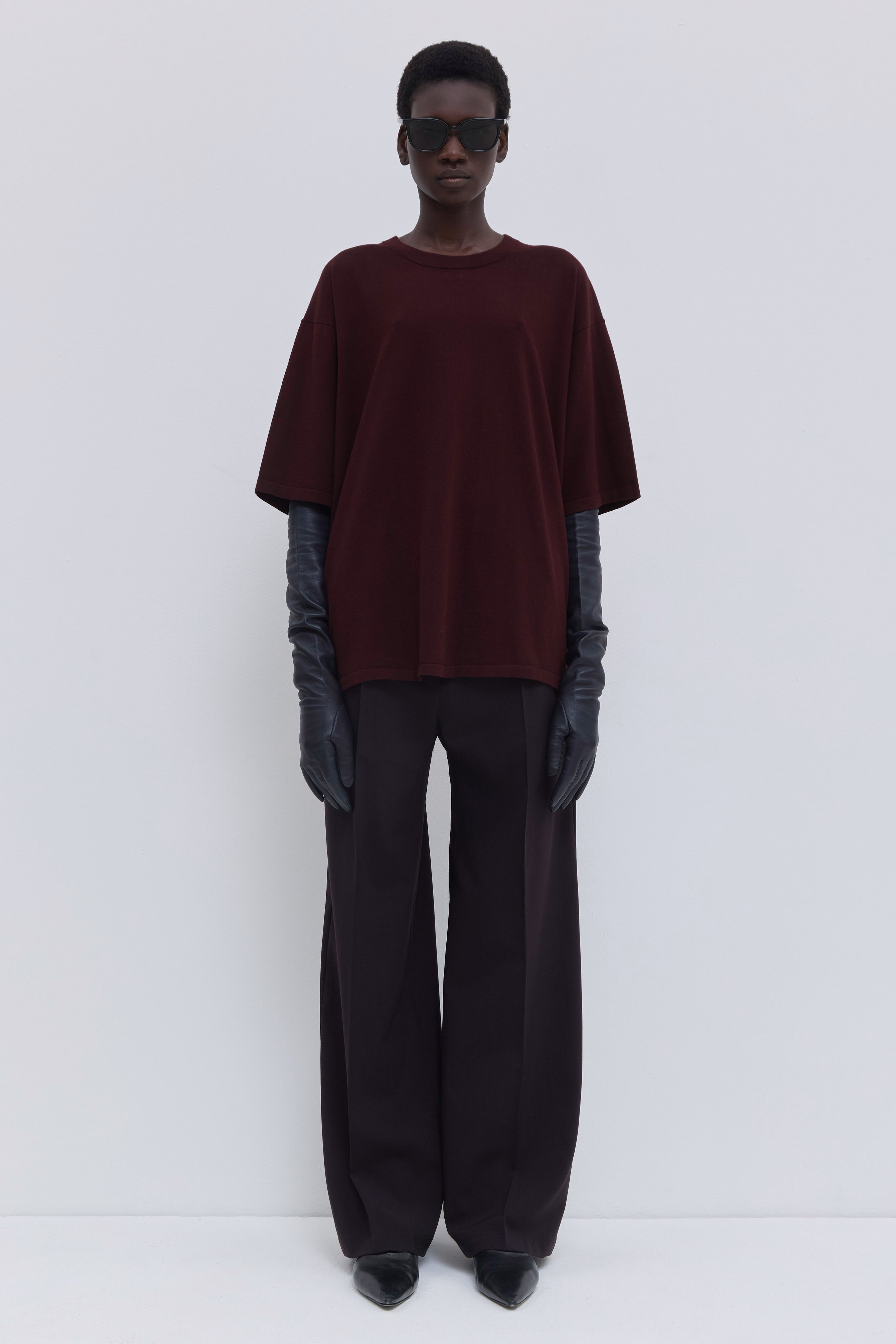 Plum oversized cotton T-shirt with dropped shoulders and back strap detail.