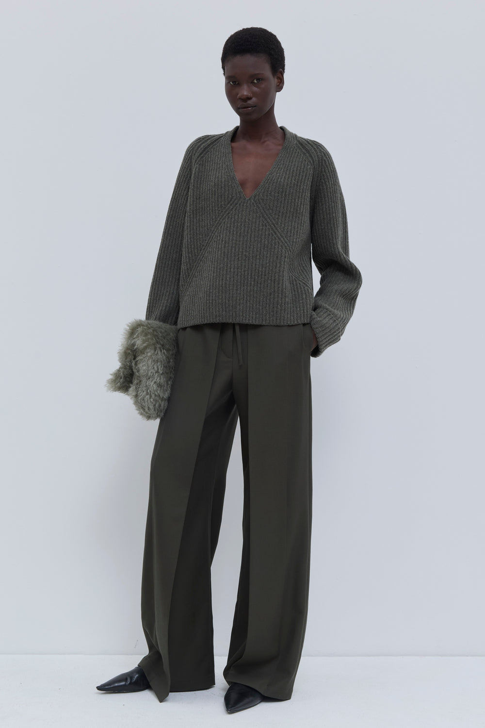 Forest melange ribbed merino wool and cashmere V-neck sweater front packshot.