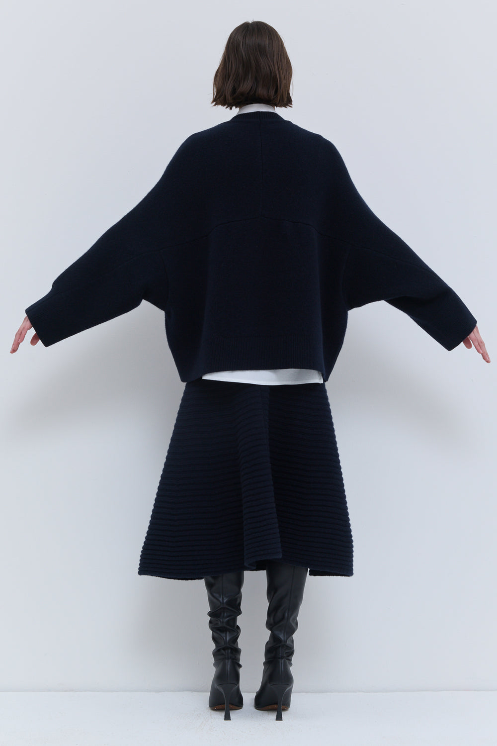 Dark marine sweater with curved horizontal seam