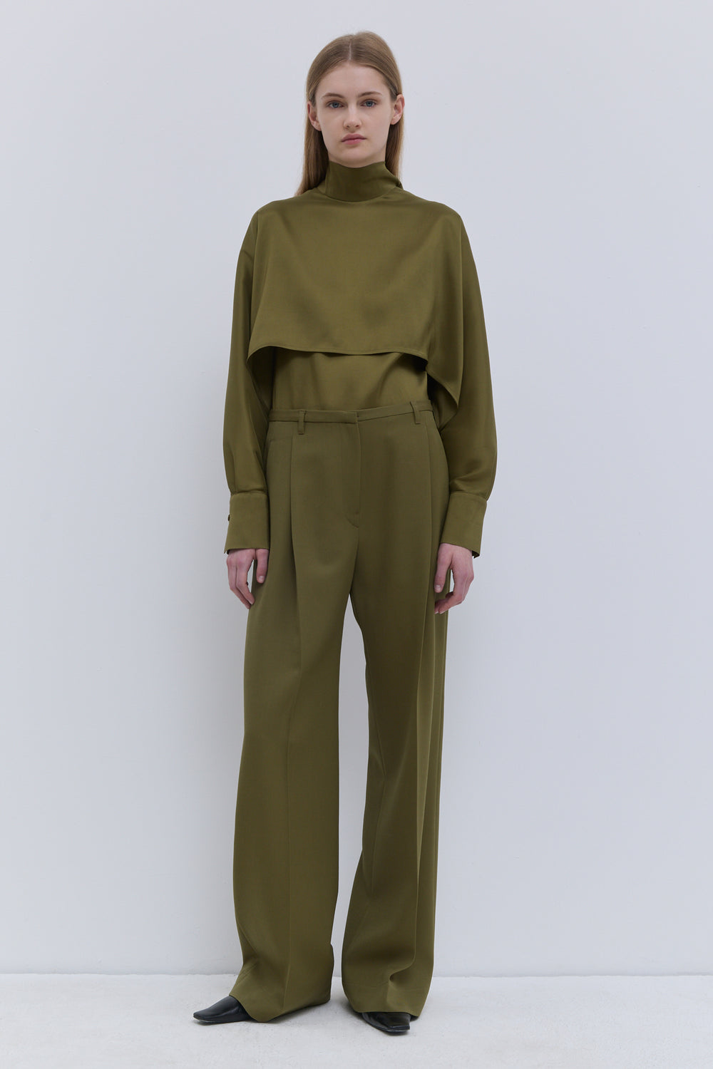 Christian Wijnants Pamira olive wide-leg trousers in fluid virgin wool, side view