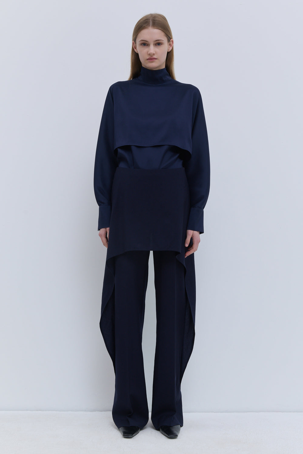 Christian Wijnants Pilba dark navy virgin wool wide-leg trousers with layered skirt overlay, shown from the front