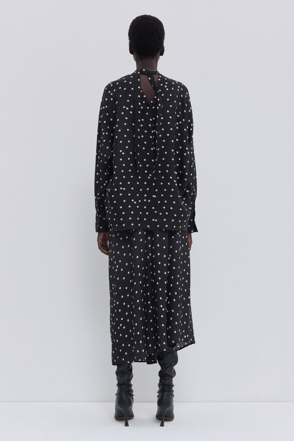 Black lady bug print satin skirt featuring an asymmetric draped shape and flowing midi length by Christian Wijnants.