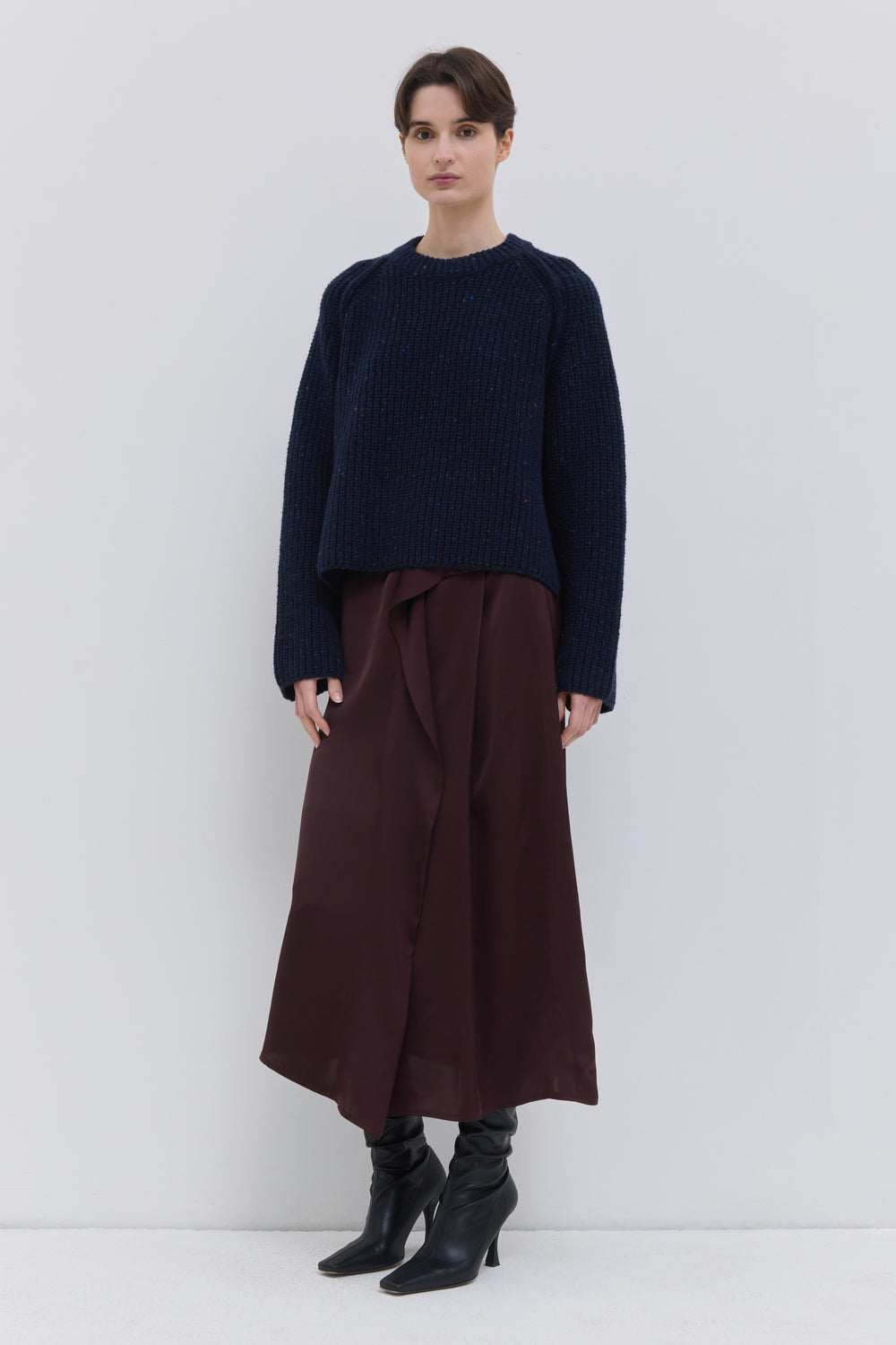 Front view of the Sedona plum draped skirt with soft elastic waistband and flowing design.
