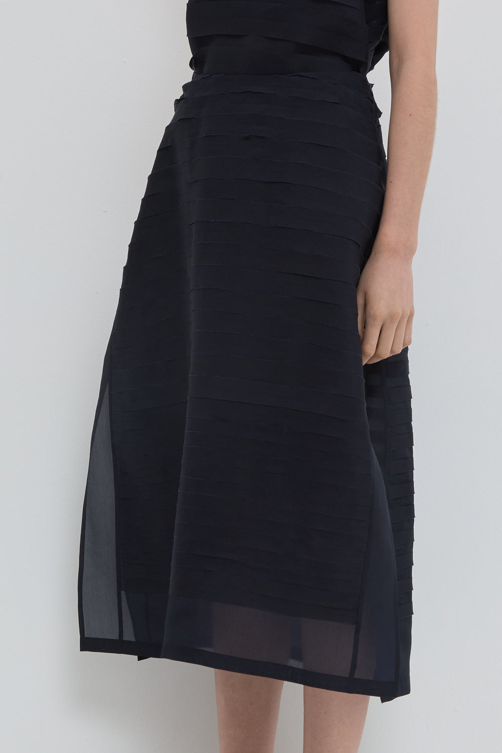 Navy silk organza A-line skirt with handmade bias stroke texture and sheer finish
