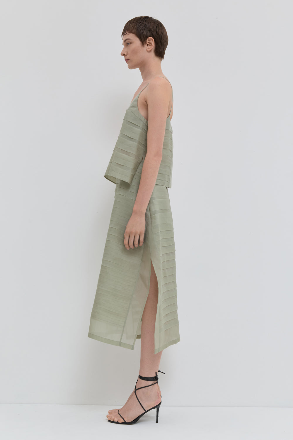 Sage silk organza A-line skirt with handmade bias stroke texture and sheer finish profile view