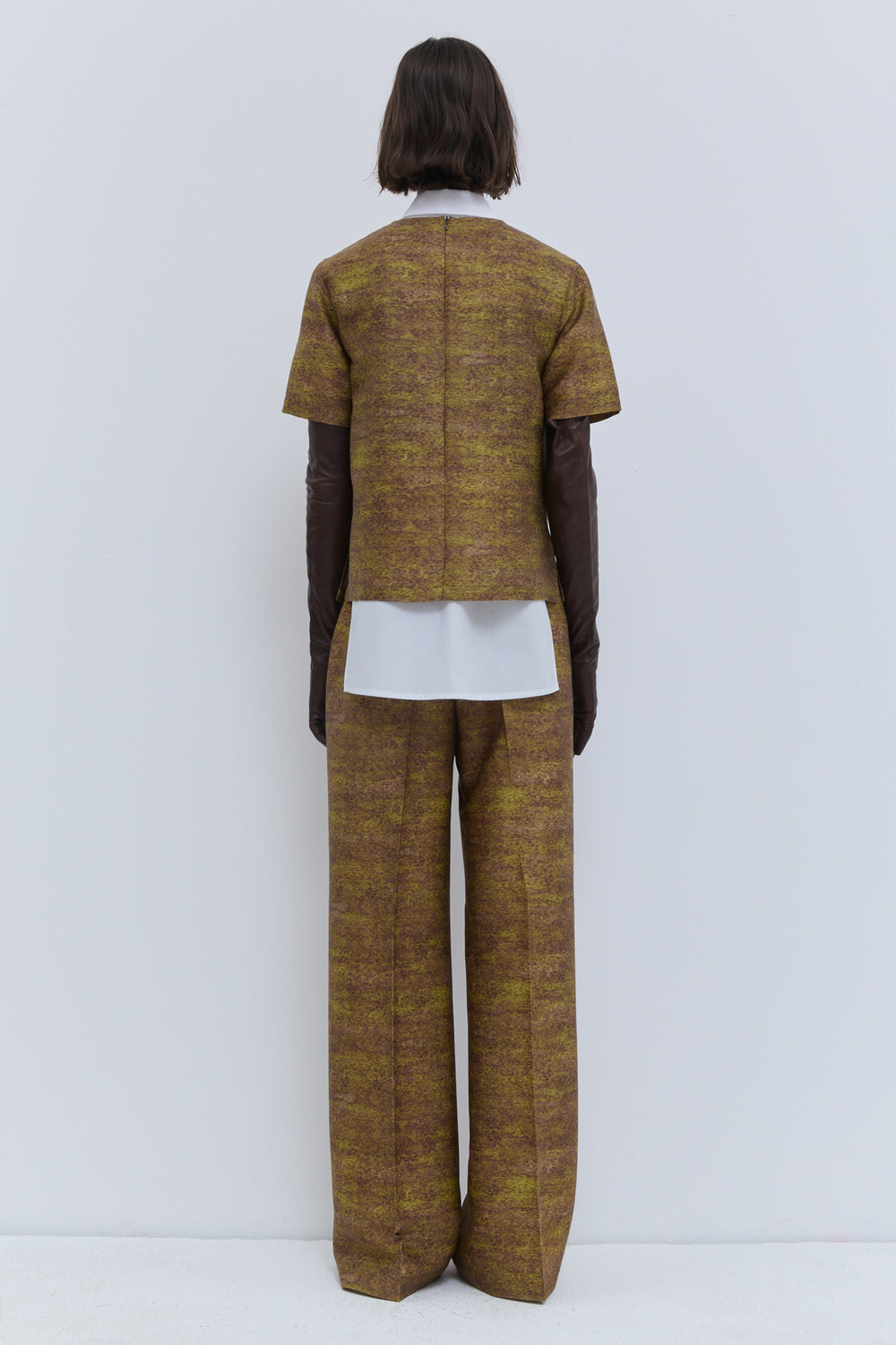 Back view of the short-sleeve Gold Storm printed wool and silk top.