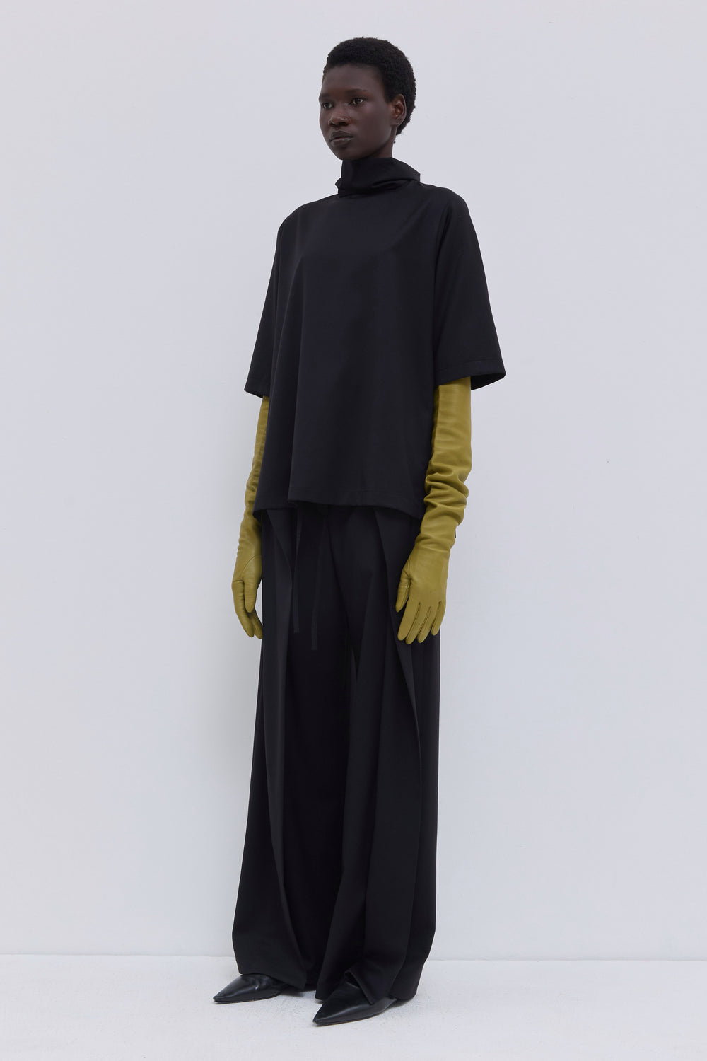 Women’s black short sleeve top with oversized side slits